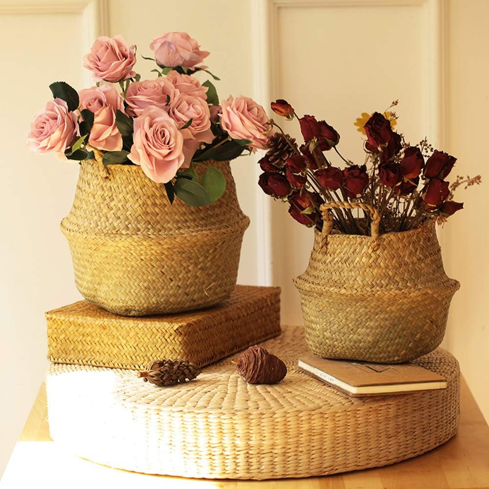 Handwoven seagrass storage baskets with pink and red roses, rustic woven planters for home decoration