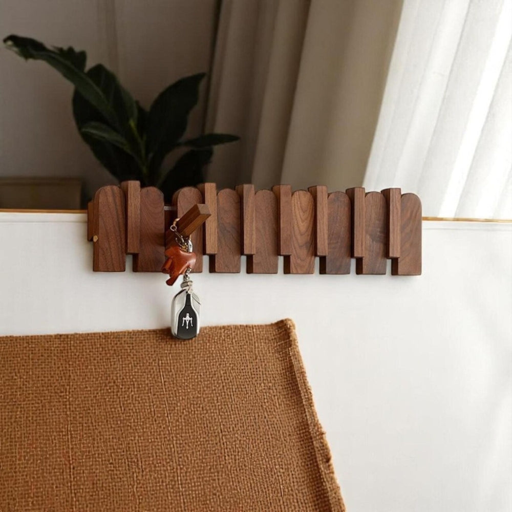 Wall-mounted wooden coat rack with foldable hooks, modern entryway organizer for jackets, bags, and keys