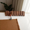 Wall-mounted wooden coat rack with foldable hooks, modern entryway organizer for jackets, bags, and keys