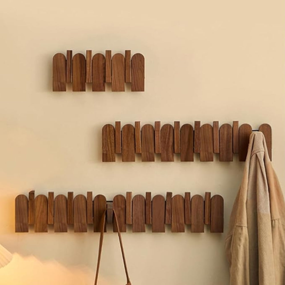 Wall-mounted wooden coat rack with foldable hooks, modern entryway organizer for jackets, bags, and keys