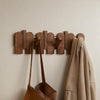 Wall-mounted wooden coat rack with foldable hooks, modern entryway organizer for jackets, bags, and keys