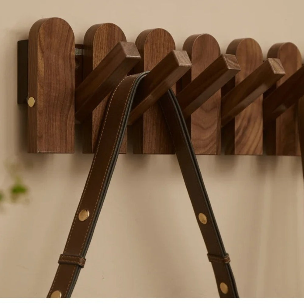 Wall-mounted wooden coat rack with foldable hooks, modern entryway organizer for jackets, bags, and keys