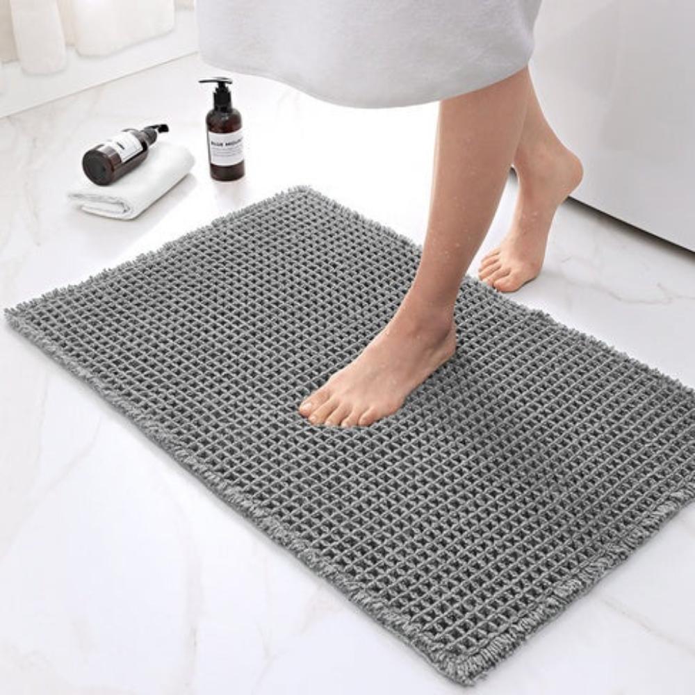 Anti-slip waffle bathroom rug in natural beige with textured weave, absorbent bath mat for shower and bathroom floor