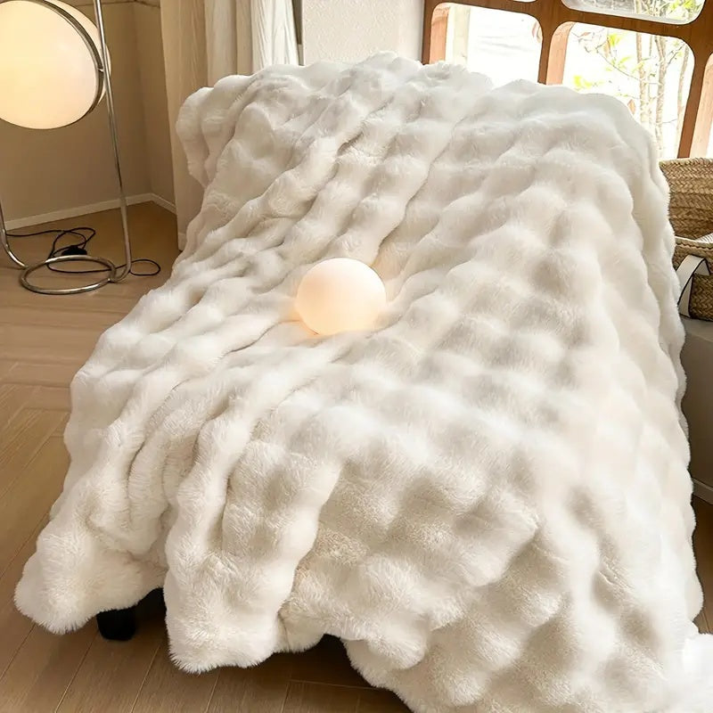 Light blue plush faux fur throw blanket with ribbed texture, ultra-soft and cozy bed or couch cover
