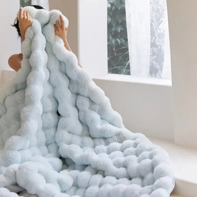 Light blue plush faux fur throw blanket with ribbed texture, ultra-soft and cozy bed or couch cover
