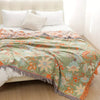 Bohemian floral sofa throw blanket with multicolor patterns and fringe edges, decorative couch cover for living room