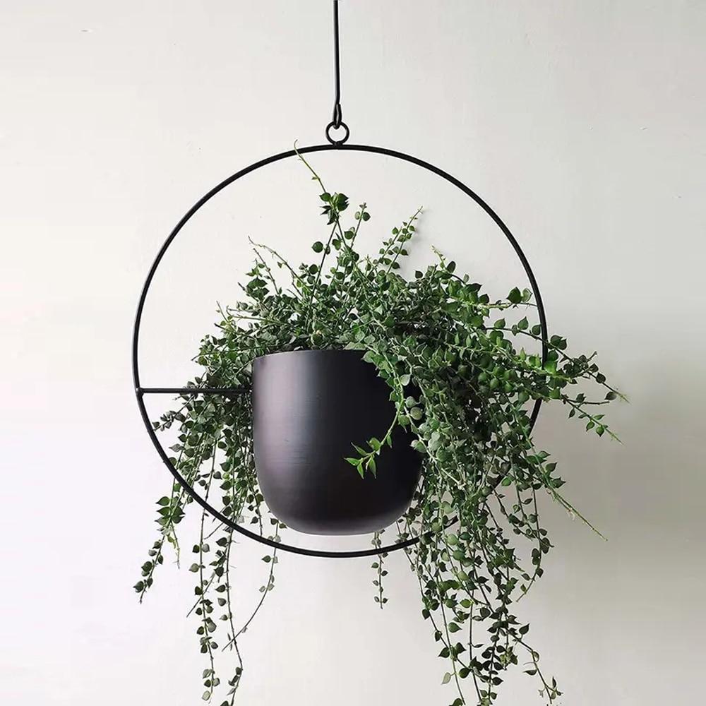 Set of modern hanging metal planters with geometric frames, indoor wall plant holders for home and balcony decor