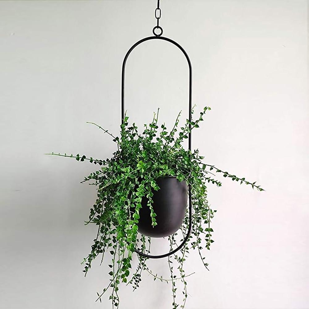 Set of modern hanging metal planters with geometric frames, indoor wall plant holders for home and balcony decor