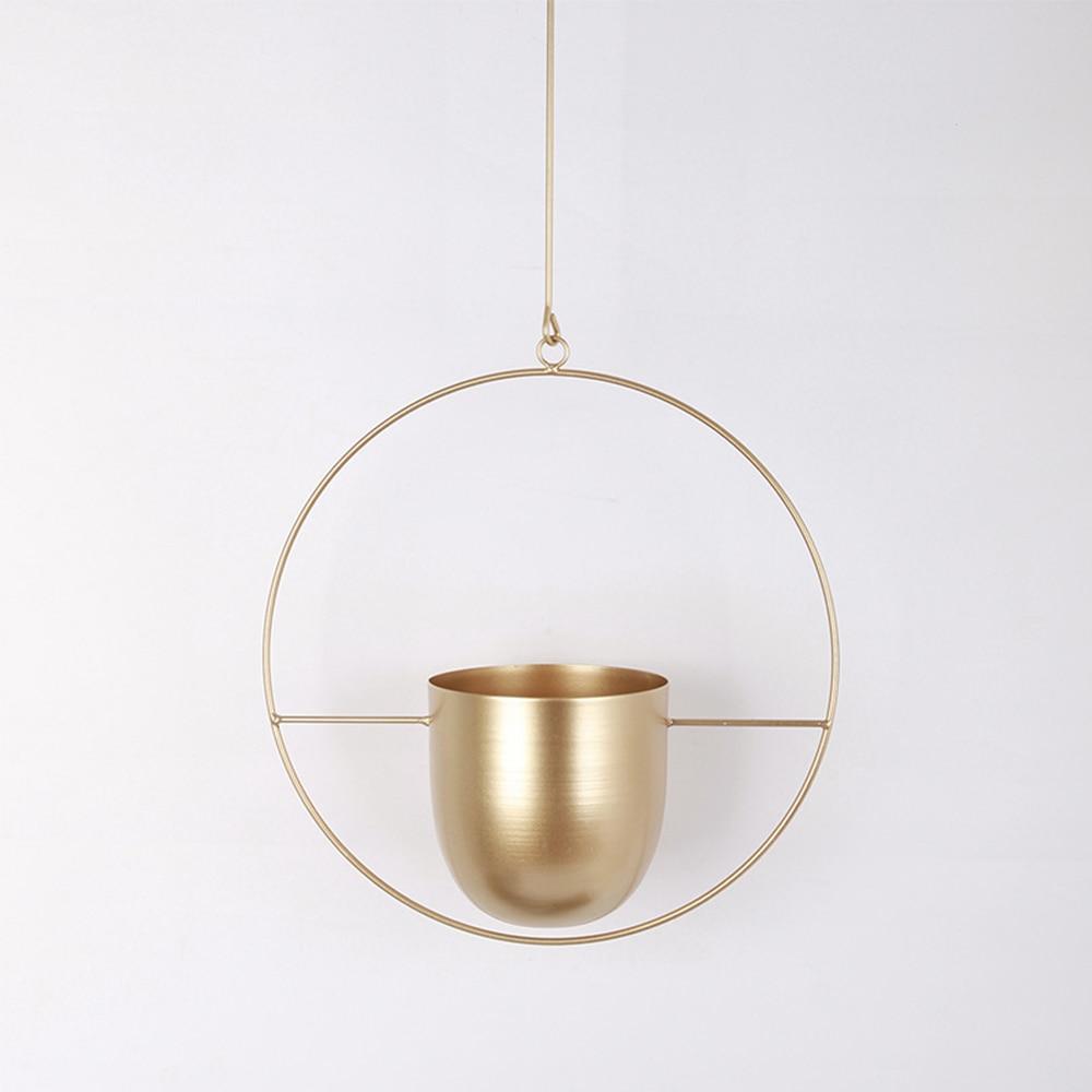 Set of modern hanging metal planters with geometric frames, indoor wall plant holders for home and balcony decor