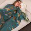 Bohemian sofa throw blanket with teal background, bird and floral patterns, and fringe edges, decorative couch cover for living room